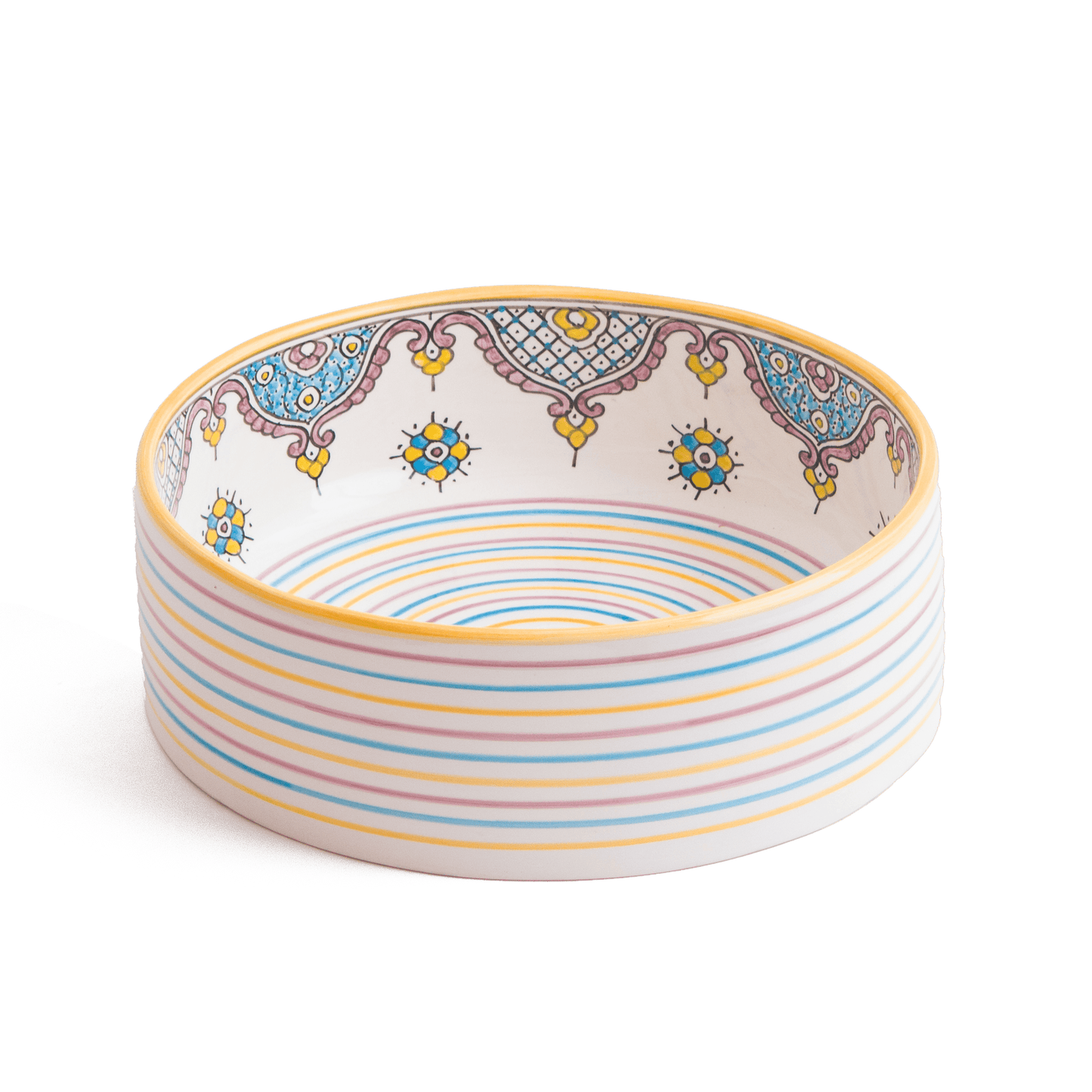 Artisanal ceramic bathroom sink showing interior geometric patterns and striped base design