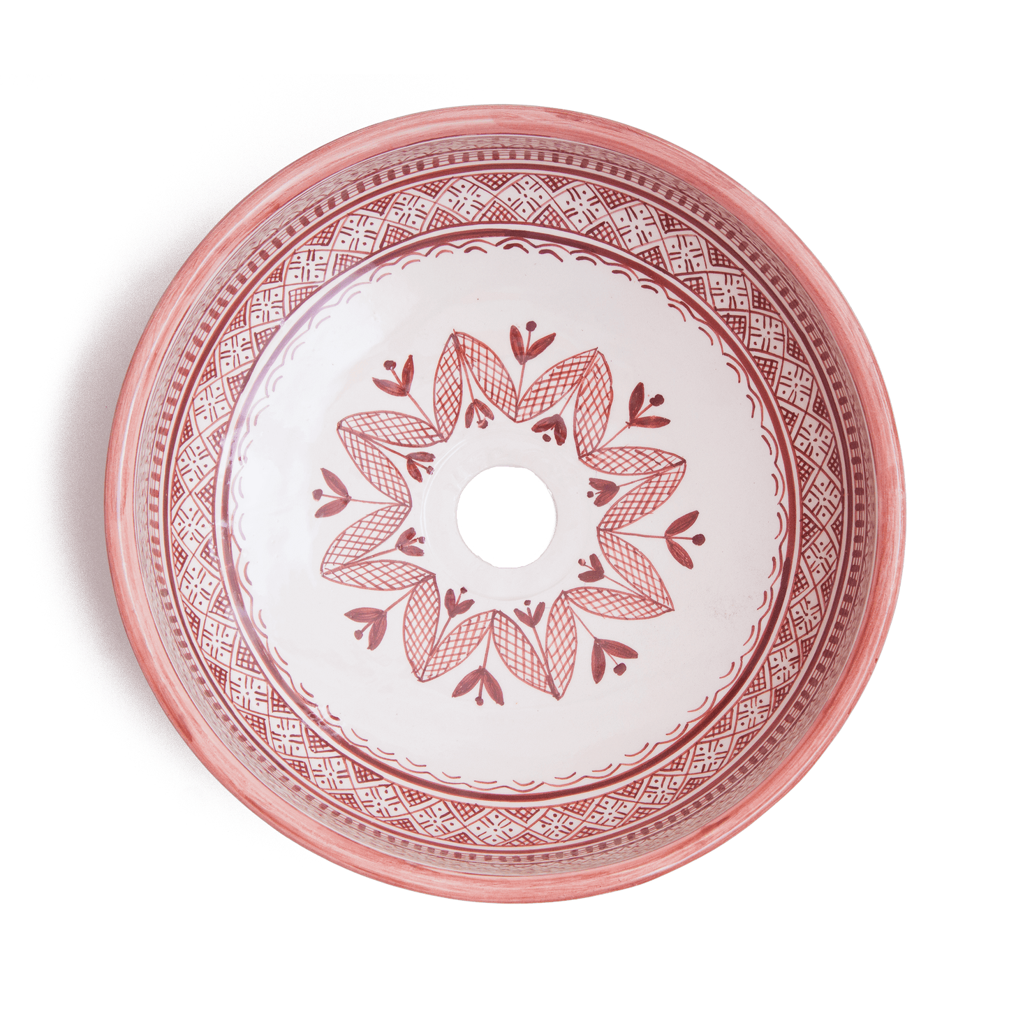 Overhead view of Moroccan round ceramic basin displaying full interior floral pattern with central drain opening