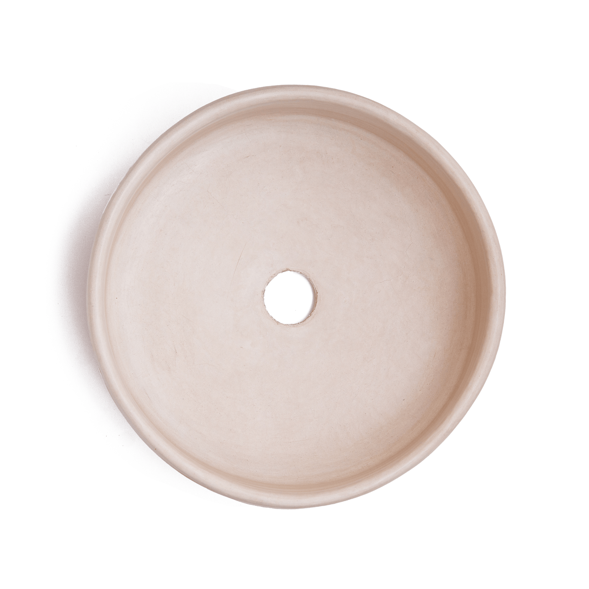 Top-down view of vessel sink interior displaying smooth cream-colored ceramic surface