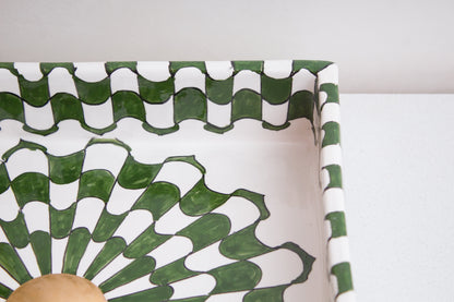 Detailed view of corner section showing intricate green and white geometric pattern and artisan ceramic craftsmanship