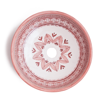 Overhead view of Moroccan round ceramic basin displaying full interior floral pattern with central drain opening