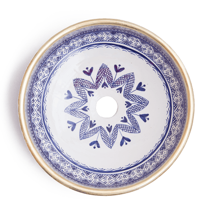 Overhead view of Moroccan round ceramic basin displaying full interior floral pattern with central drain opening
