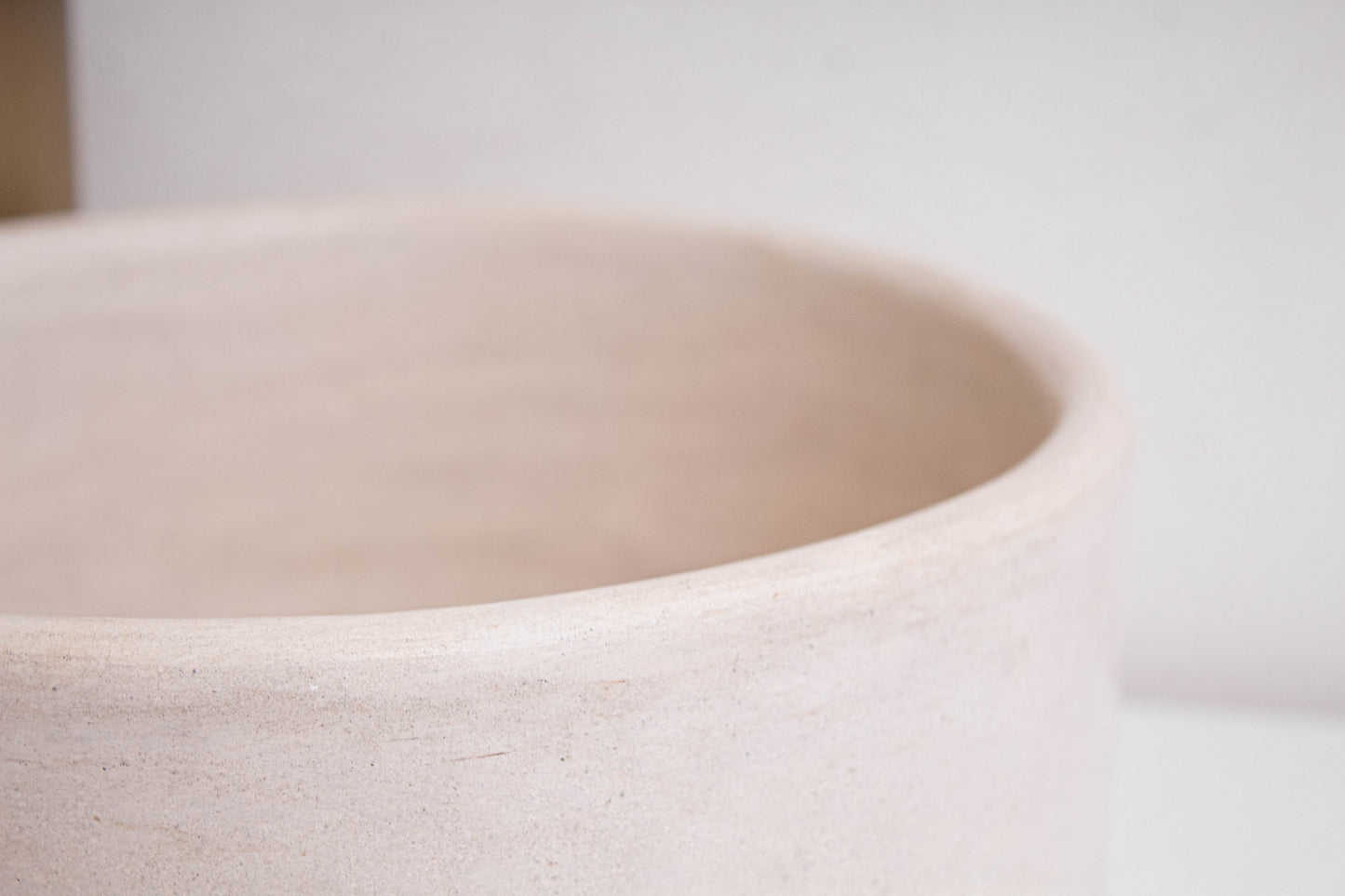 Close-up interior detail view showing smooth tadelakt surface and rounded edges of artisan-crafted Moroccan ceramic bathroom basin