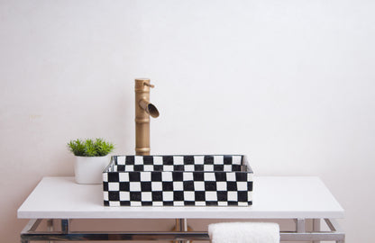 Front lifestyle view of checkerboard vessel sink with brass faucet in contemporary bathroom