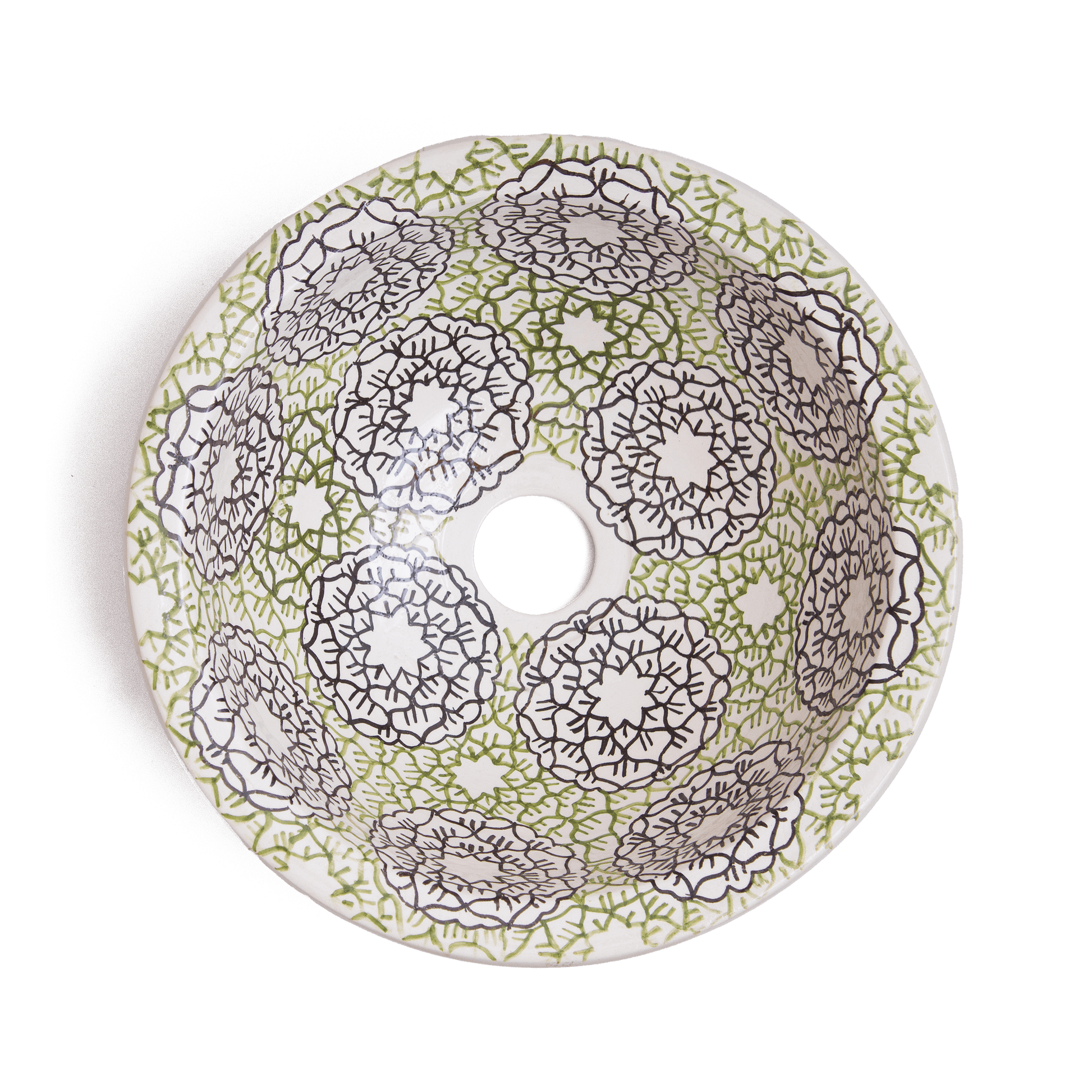Interior view of handcrafted ceramic basin displaying intricate green and brown geometric mandala patterns