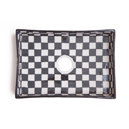 Top-down view of rectangular ceramic basin displaying interior checkerboard pattern