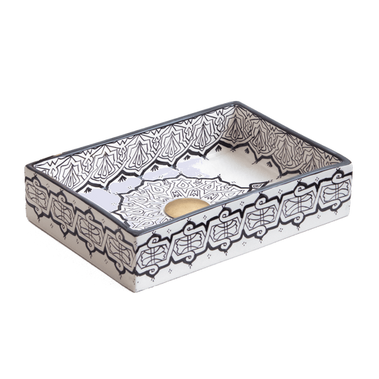 Handmade Moroccan ceramic rectangular vessel sink with black and white Fassi zellige patterns, featuring a gold drain.