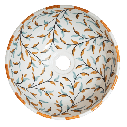 Top-down interior view of ceramic vessel sink showing olive leaf and branch pattern with central drain opening