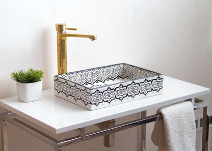 Installed Moroccan ceramic vessel sink on white countertop with gold faucet and small plant, showcasing elegant bathroom application and proper placement