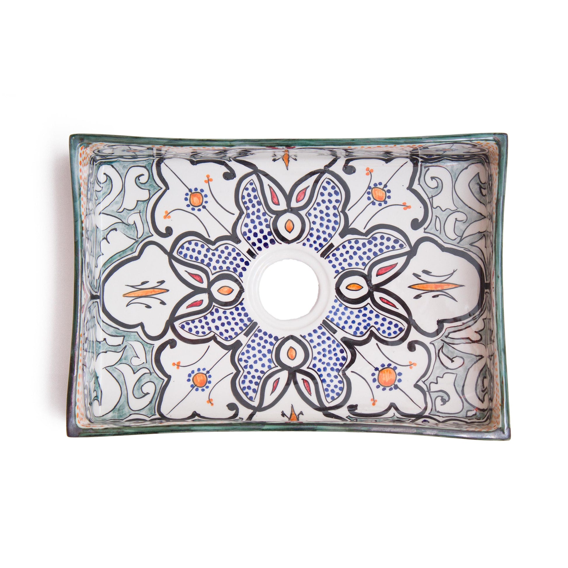 Top-down view revealing complete interior geometric medallion pattern design of rectangular ceramic bathroom sink with centered drain opening