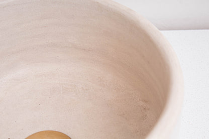 Detailed view of natural beige ceramic texture and smooth tadelakt finish on handmade Moroccan vessel sink