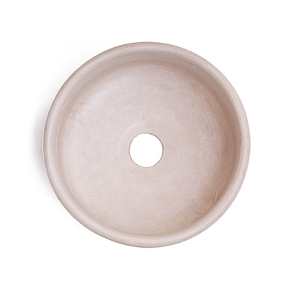 Top-down view of handcrafted Moroccan round ceramic vessel sink showing smooth interior surface with centered drain opening